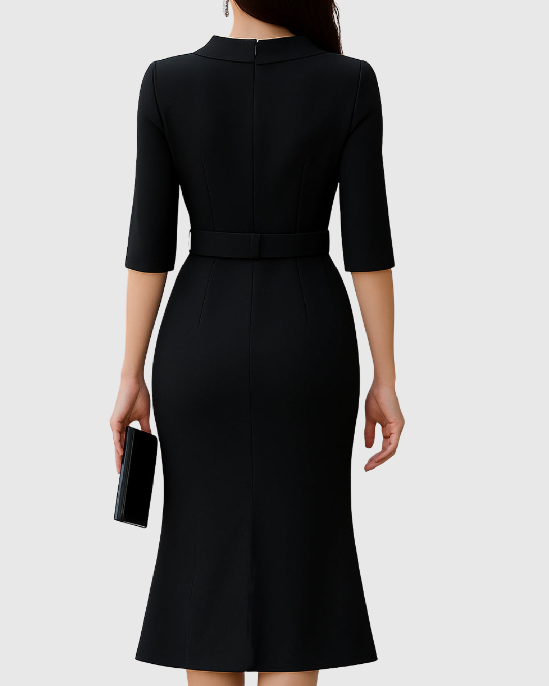 Blythewyn black midi dress, back view showing tailored seams and belt