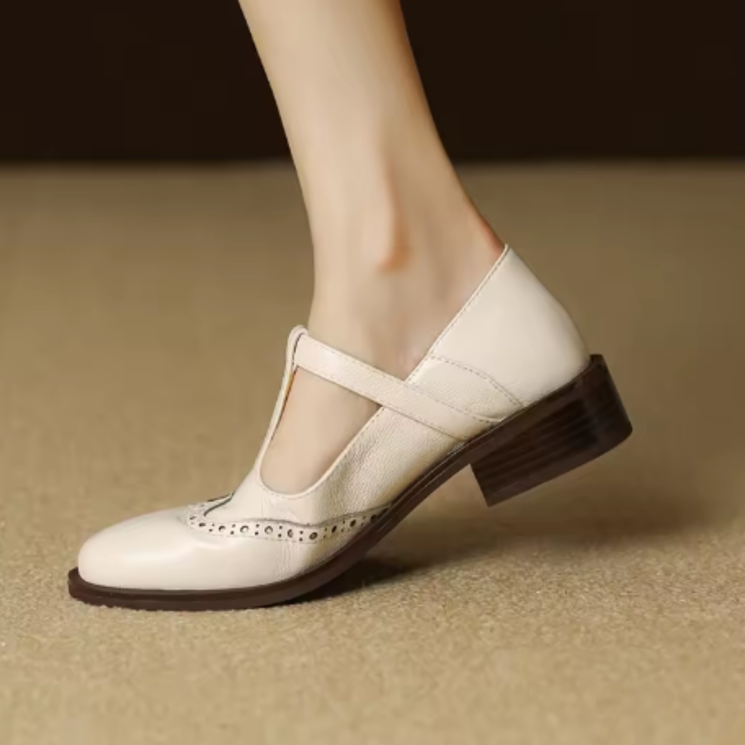 Ysolenne T-bar Mary Jane in beige, close-up of block heel and strap