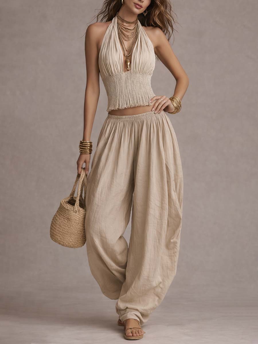 Danna two-piece set in beige, model walking with straw bag