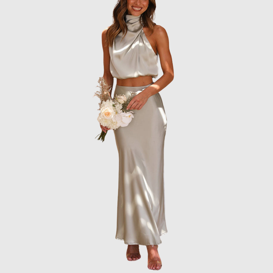 Emily satin two-piece set in champagne, worn with a bridal bouquet