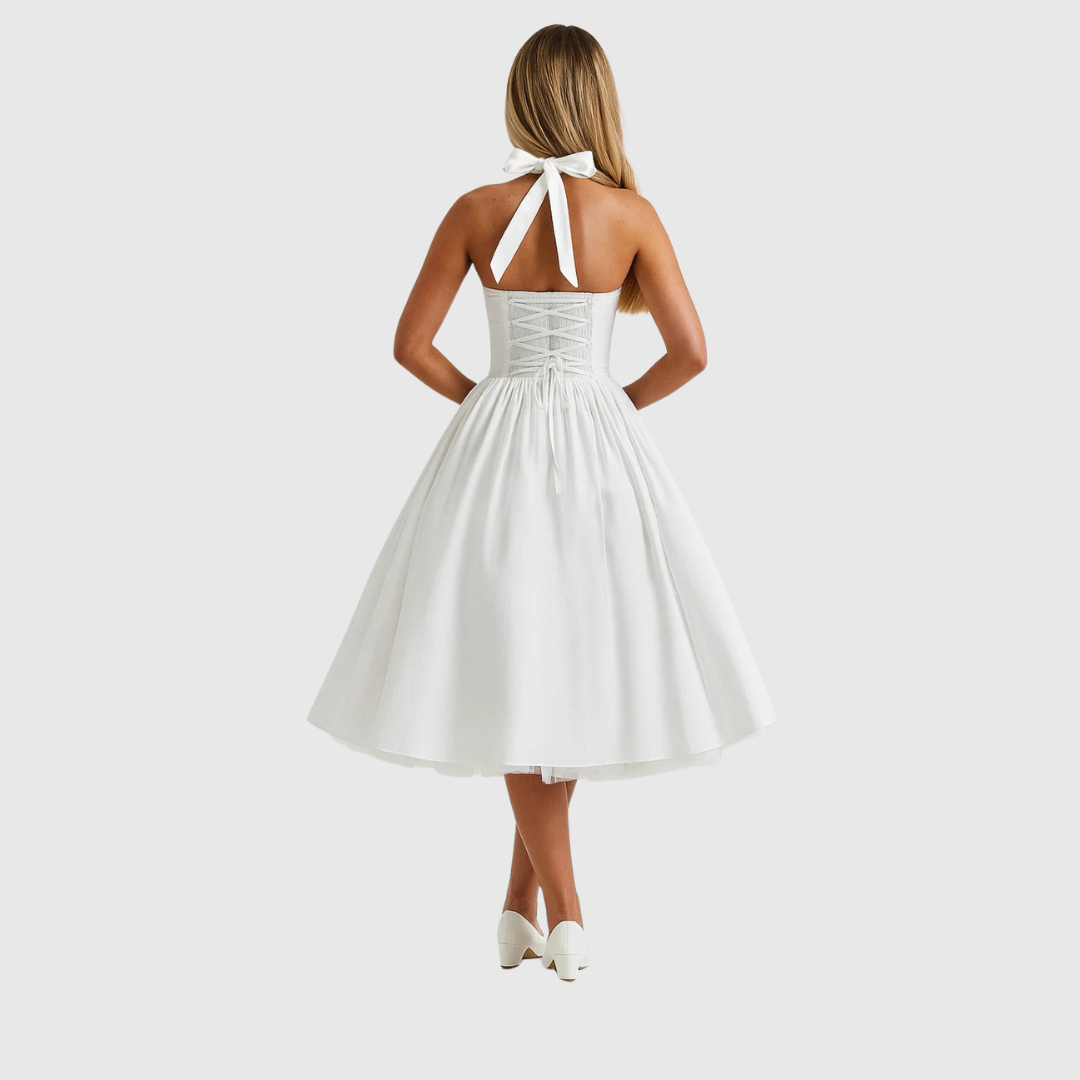 Verity halter midi dress in white, back view with laced bodice and neck bow