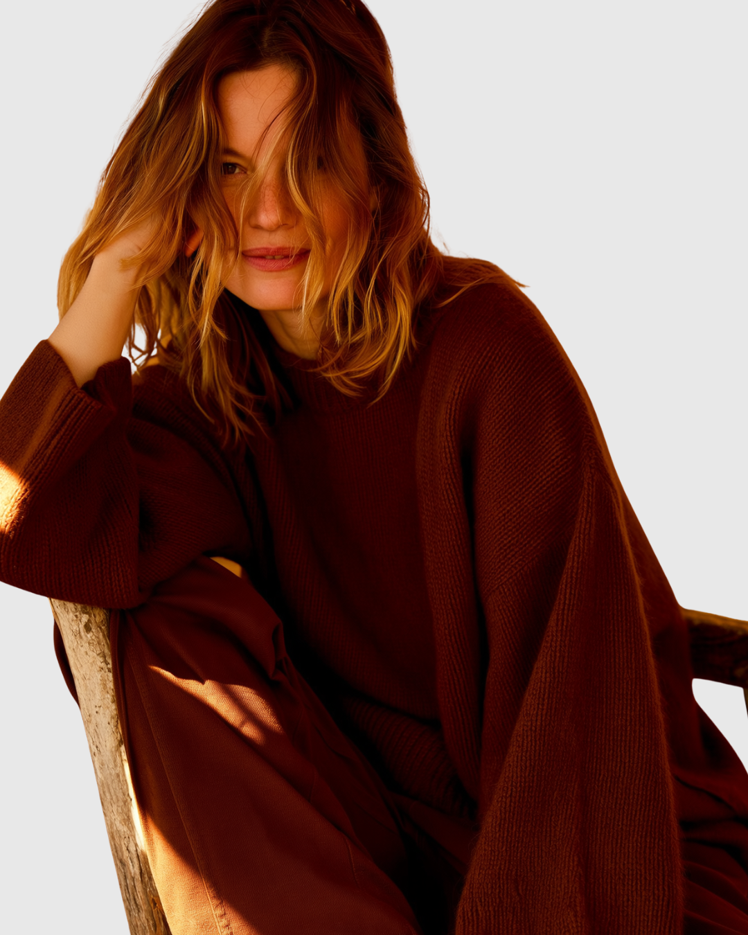 Colette oversized sweater in deep burgundy, seated three-quarter view