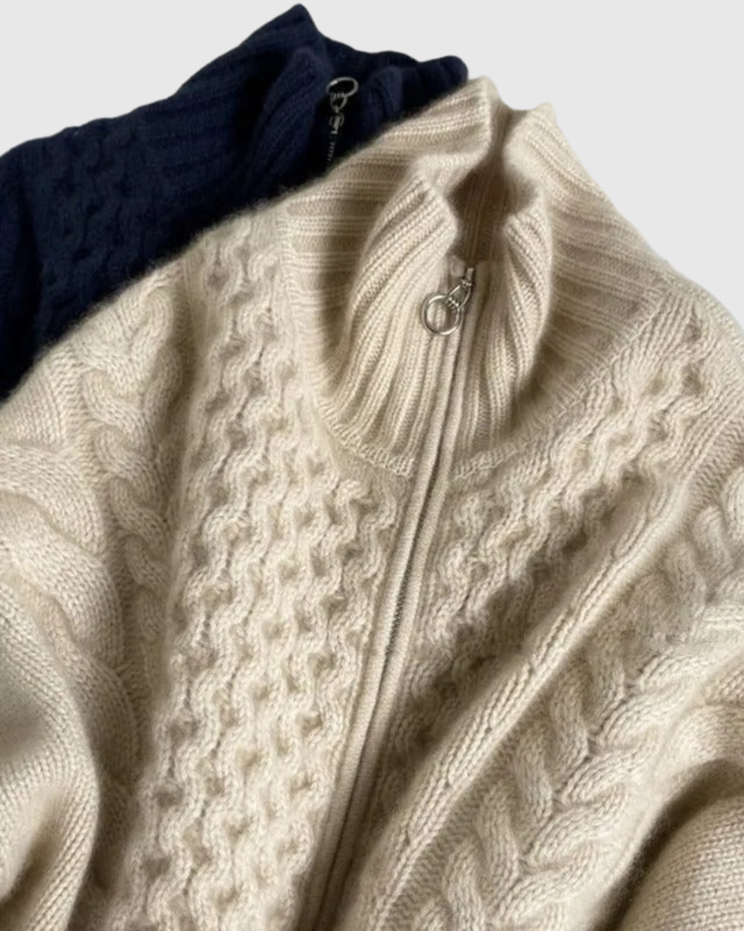 Evarine cable-knit cardigan in cream and navy, zip and collar detail