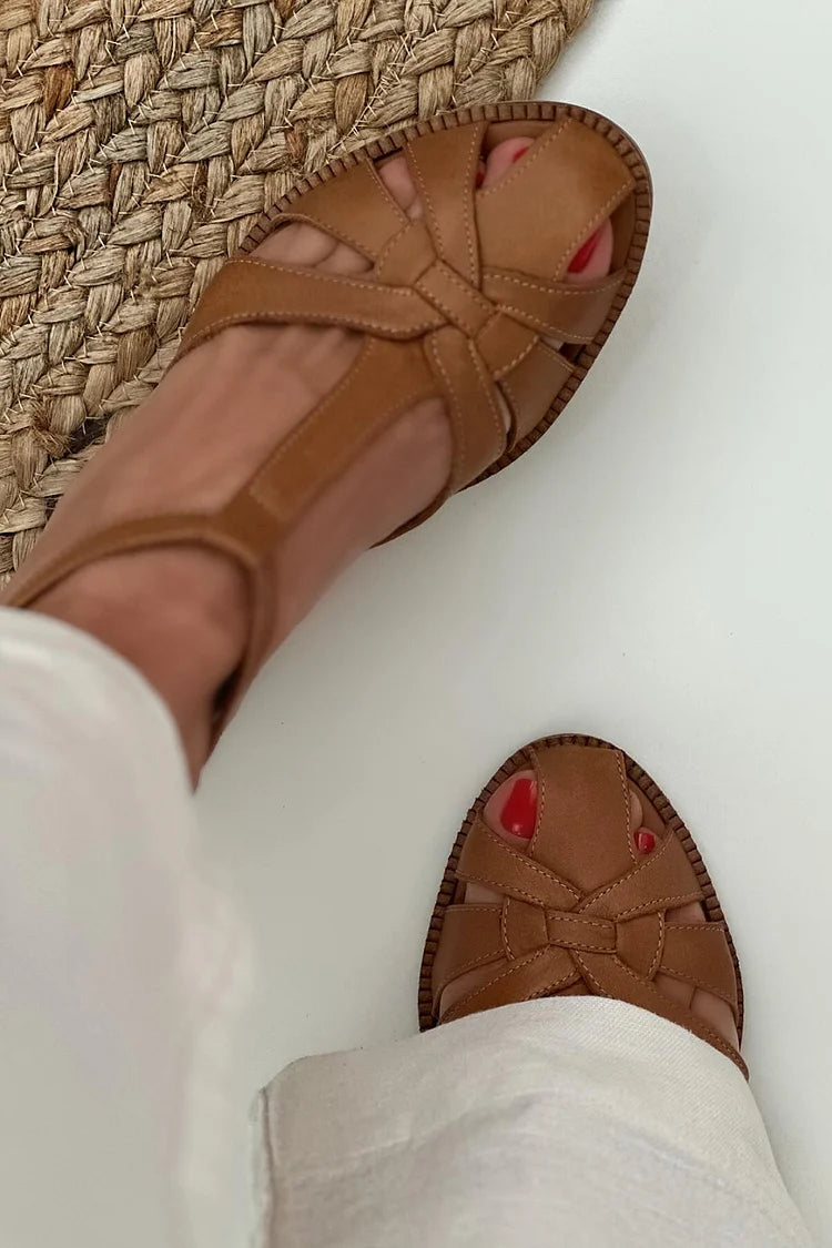 Brown woven cut-out block heels worn with white trousers, top view