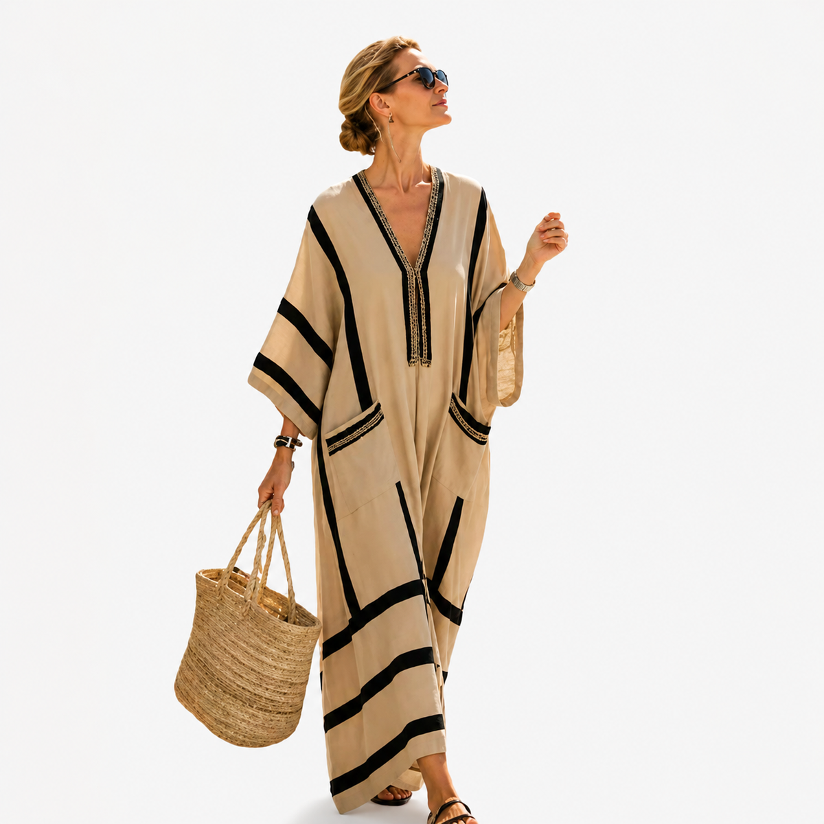 Long striped kaftan in sand with black stripes, full-length front view on model