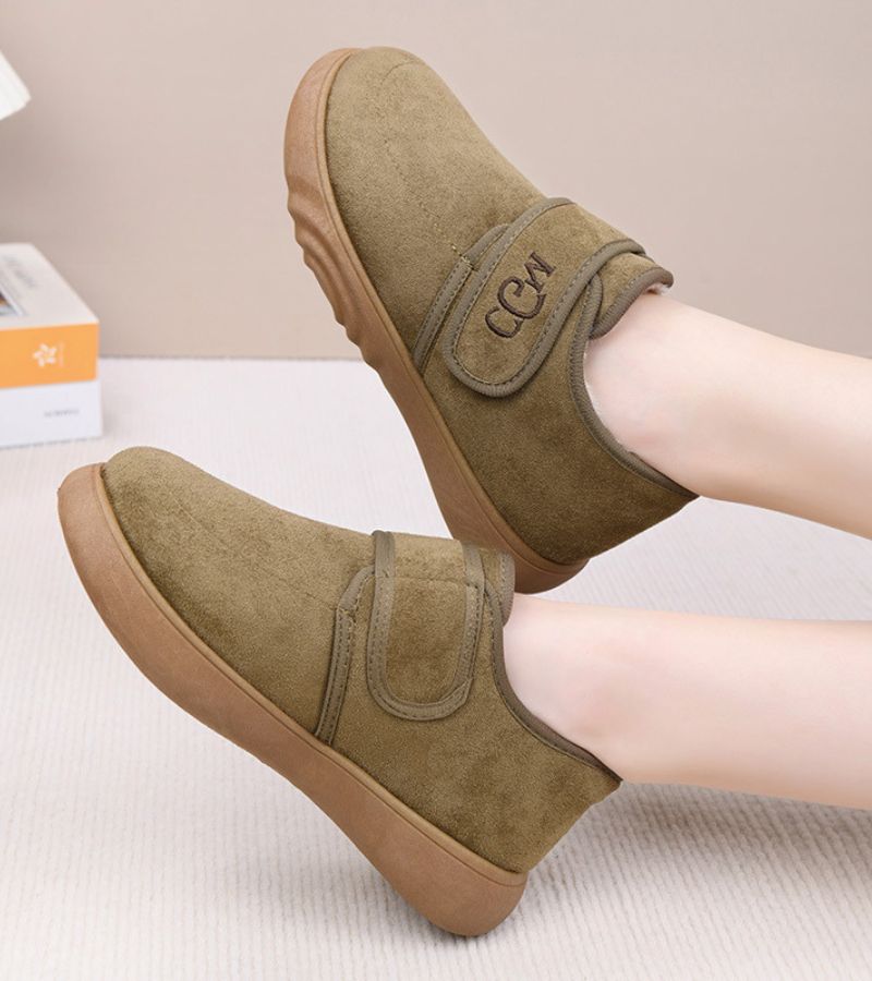 Doralise strap shoes in khaki, worn with feet raised side view