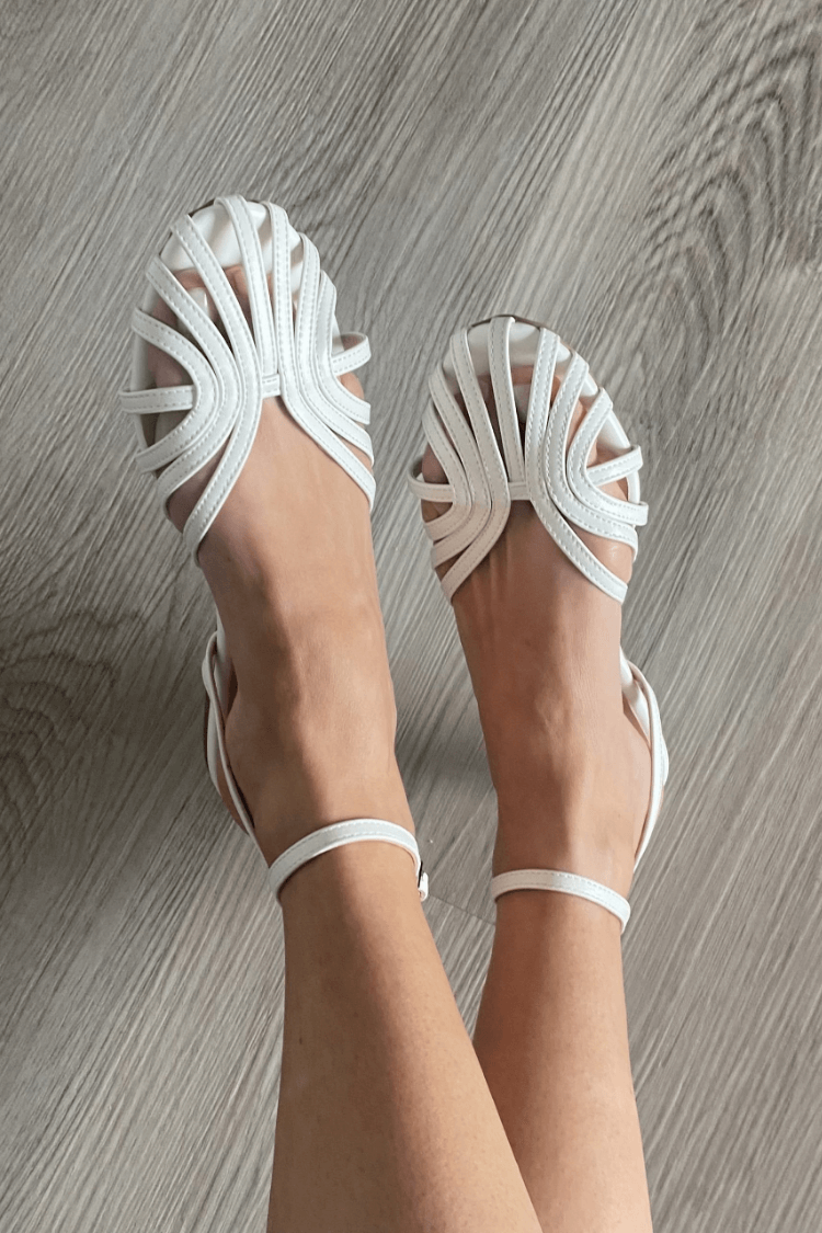 Round-toe cut-out ballet flats in white, top view on model