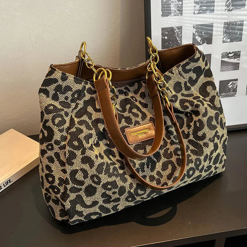 Tavira leopard tote bag, three-quarter view showing brown handles