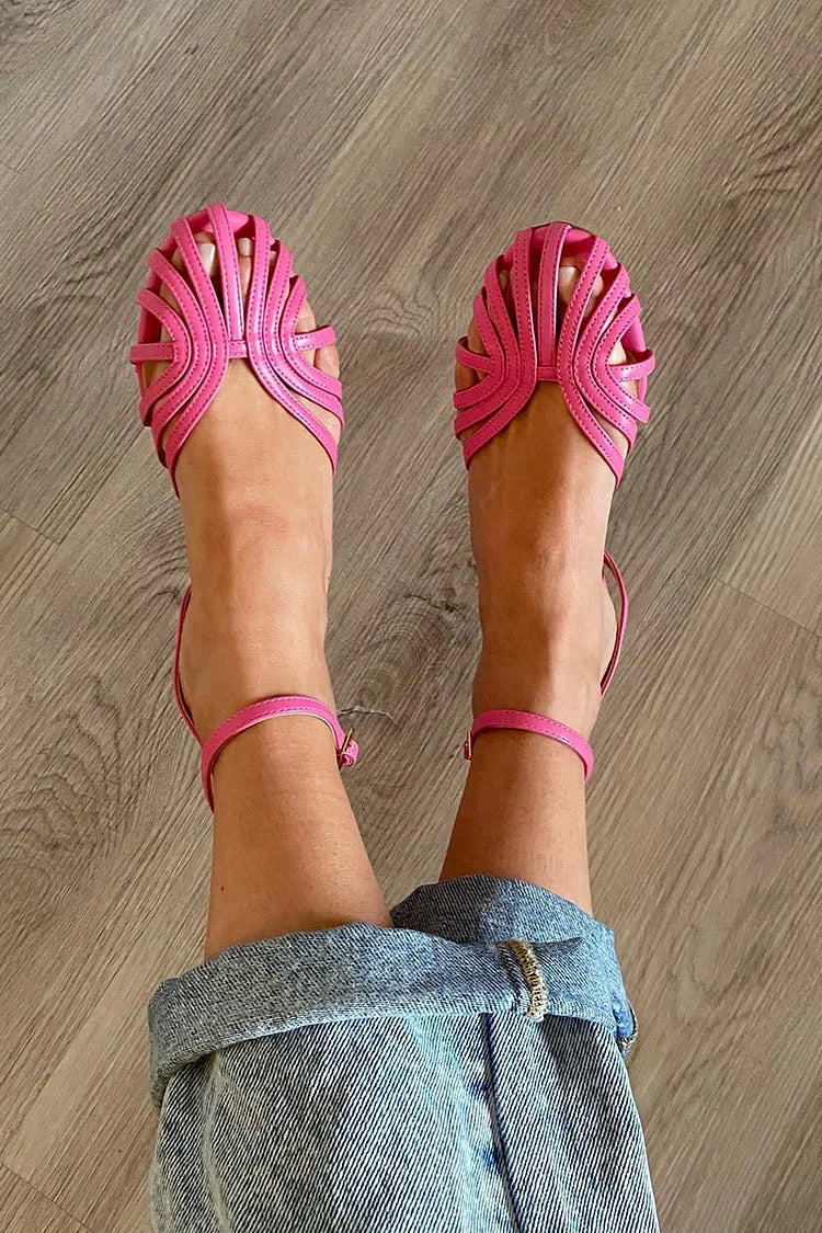 Round-toe cut-out ballet flats in pink, worn with jeans, top view