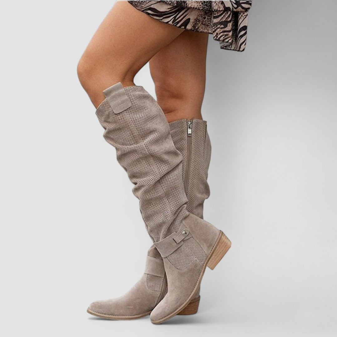 Georgiana slouch knee boots in khaki, worn with a printed skirt