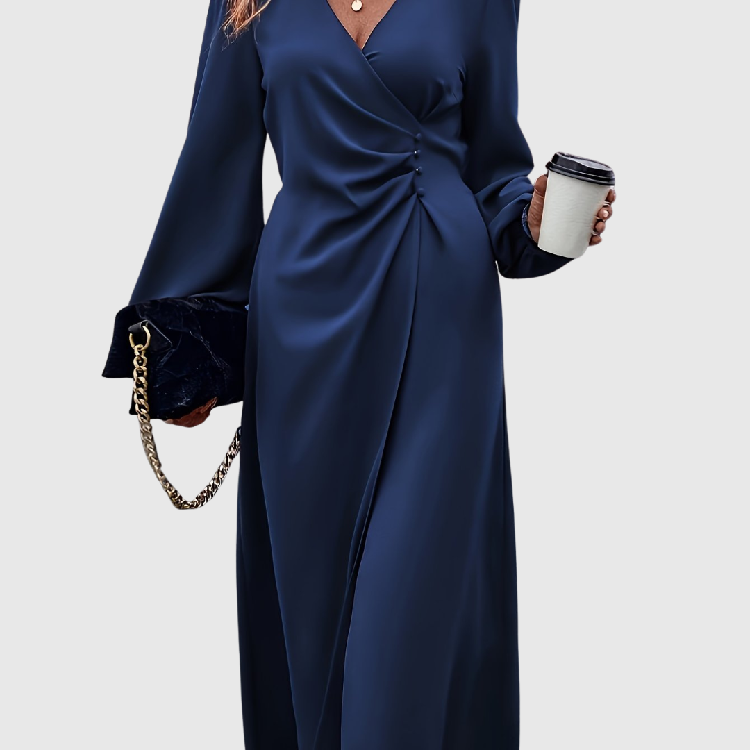 Close-up of the twist front waist detail on the Islanna navy midi dress