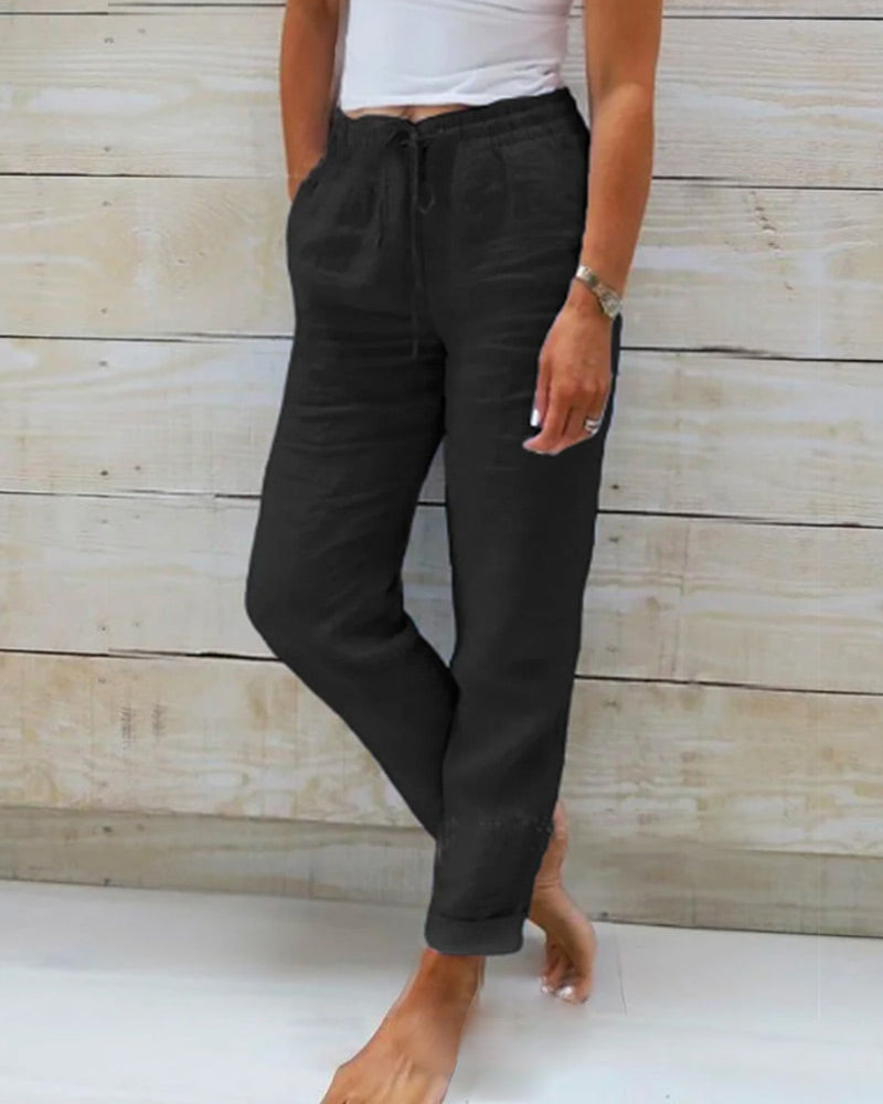 Averie relaxed drawstring trousers in black, full-length front view
