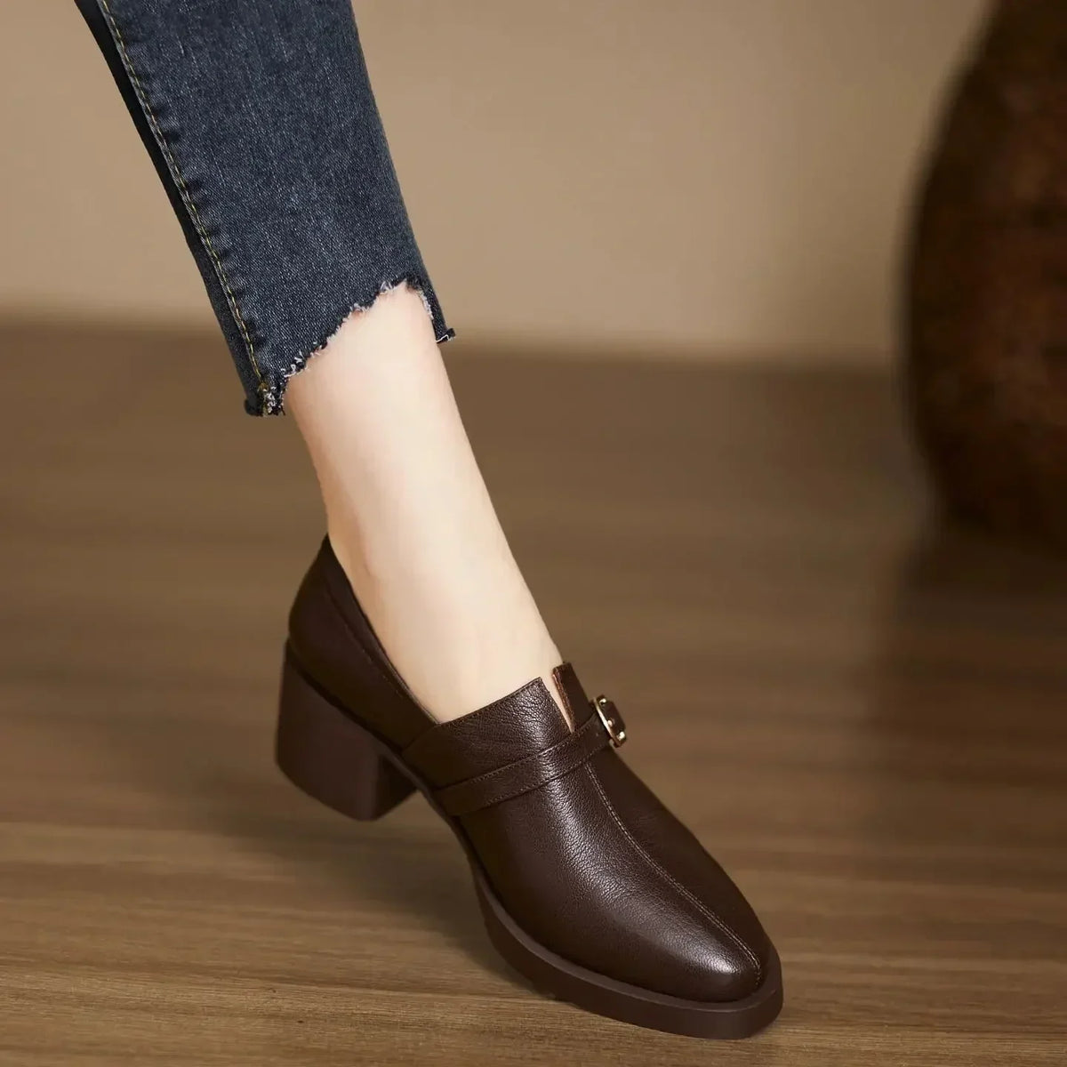 Celine block heels in brown, worn side view on wooden floor