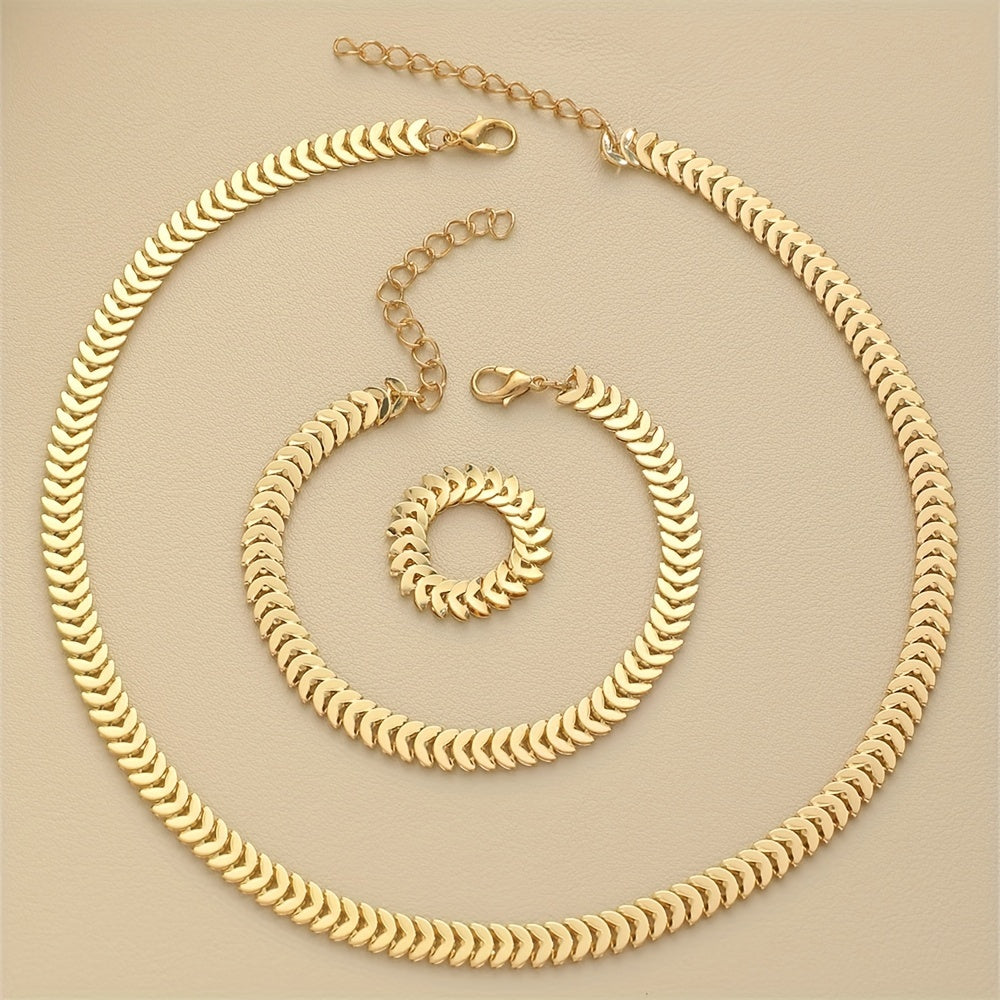 Three-piece gold chain jewellery set flat lay, full view