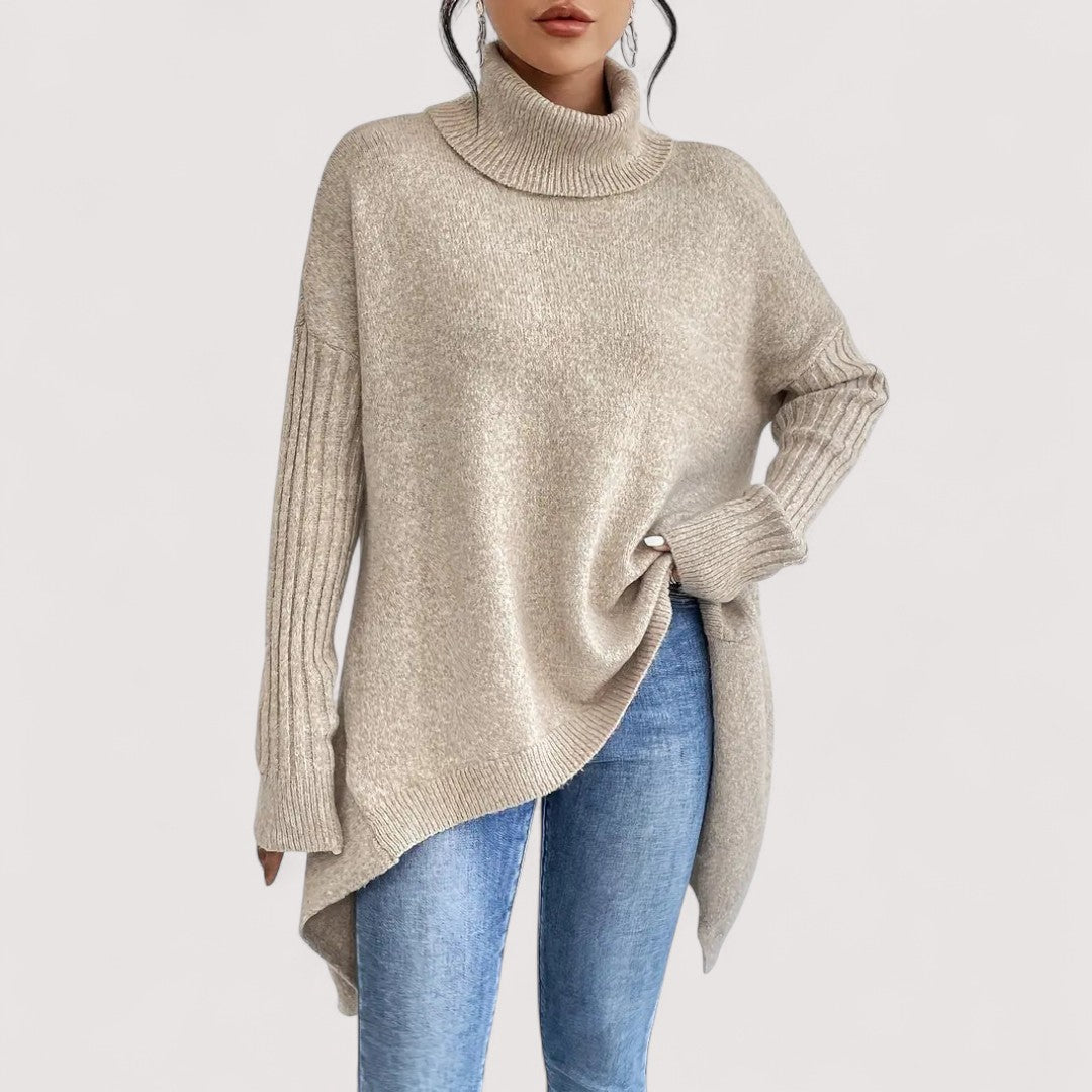 Fenella long turtleneck sweater in desert khaki, side view showing asymmetrical hem