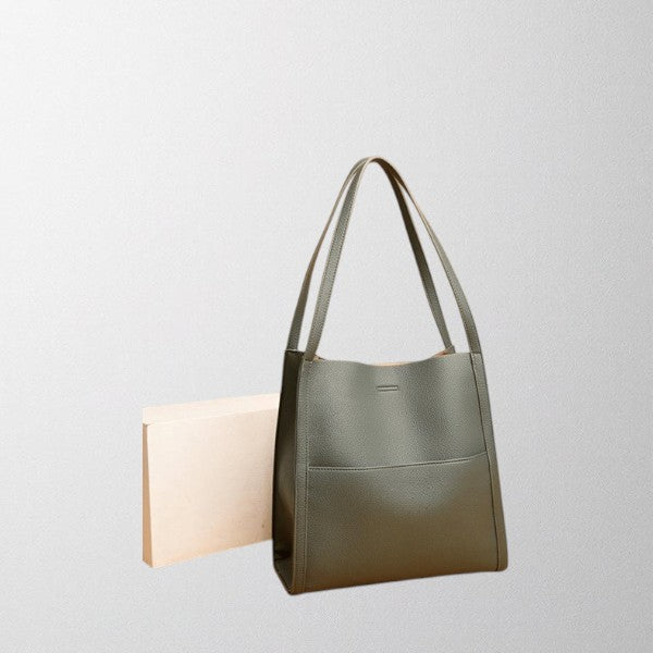 Valérie Dupré shoulder bag in green, side view with straps upright