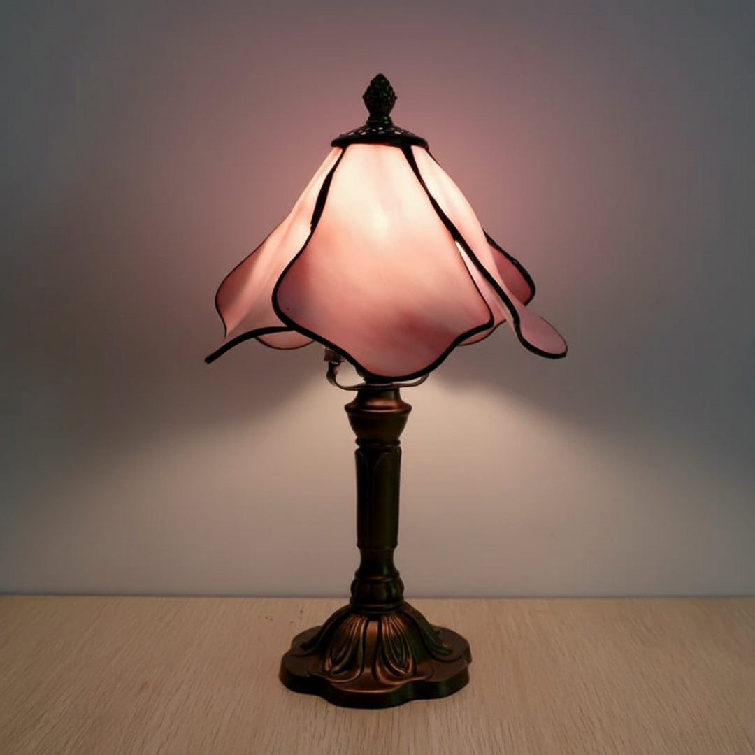 Rose Fairy stained-glass table lamp with pink petal shade and bronze base