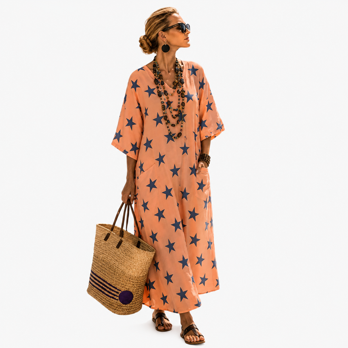 Long kaftan in orange with blue star print, full-length front view