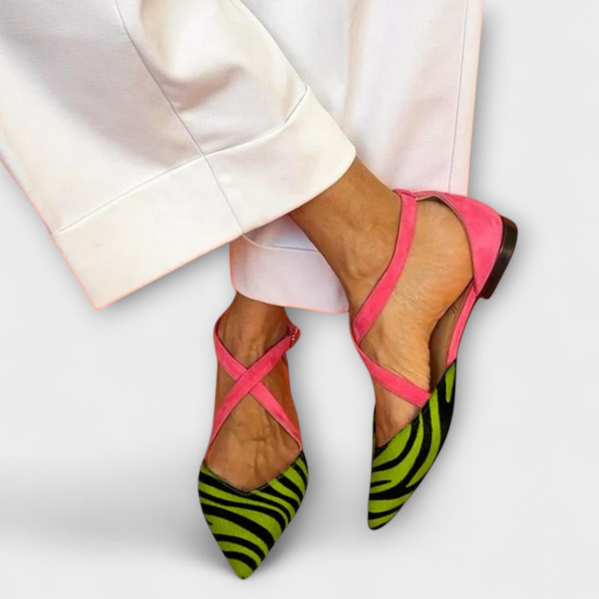 Gabrielle band detail loafers in green zebra print, worn front view
