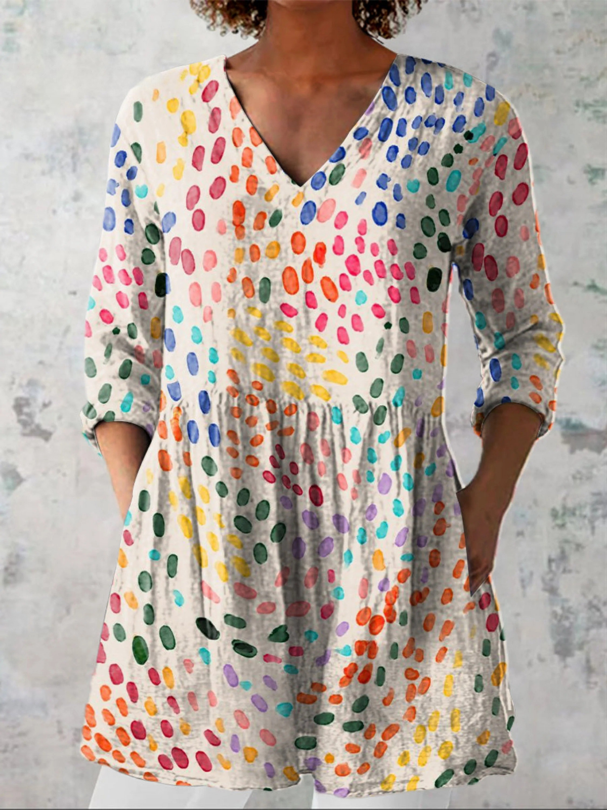 Pauline long V-neck blouse in multicoloured dot print, front view worn with white trousers