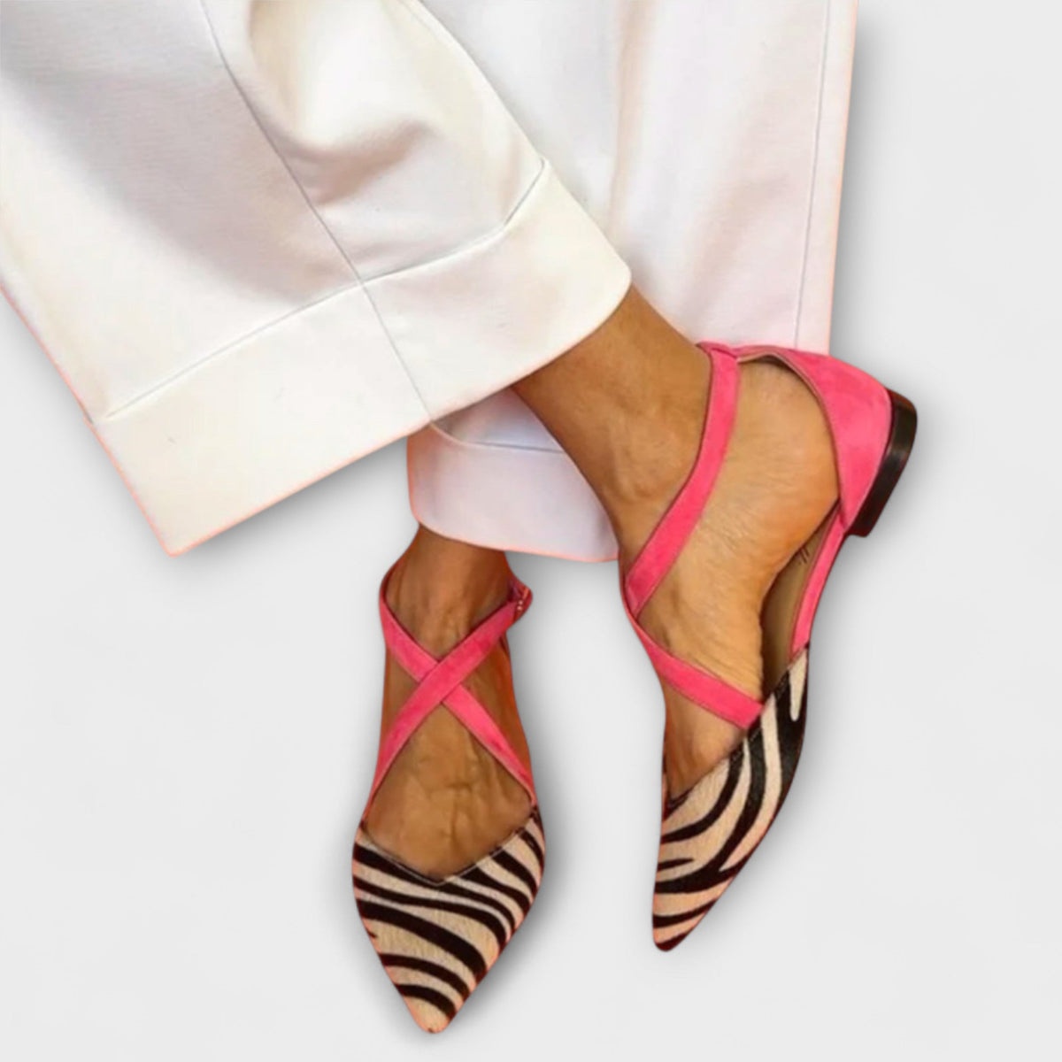 Gabrielle band detail loafers in white zebra print with pink straps, worn front view