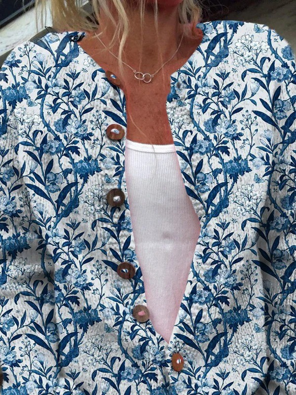 Tiverly cardigan close-up showing wooden buttons and blue botanical print