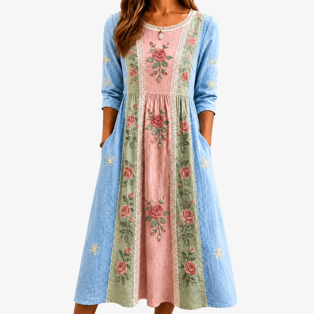 Vintage rose garden patchwork dress in blue, pink and sage, front view with pockets