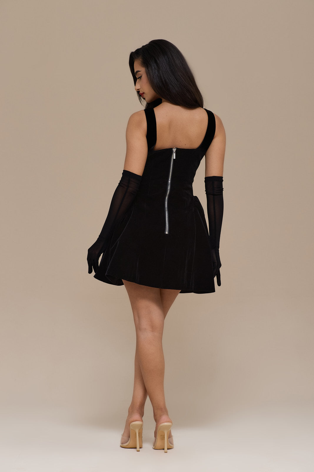 Lucky black velvet mini dress, back view with centre zip and straps