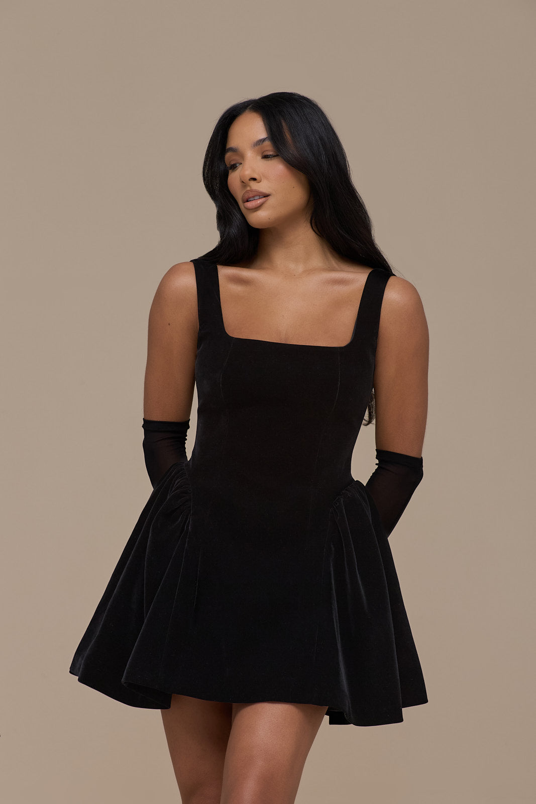Lucky black velvet mini dress, front view showing flared skirt