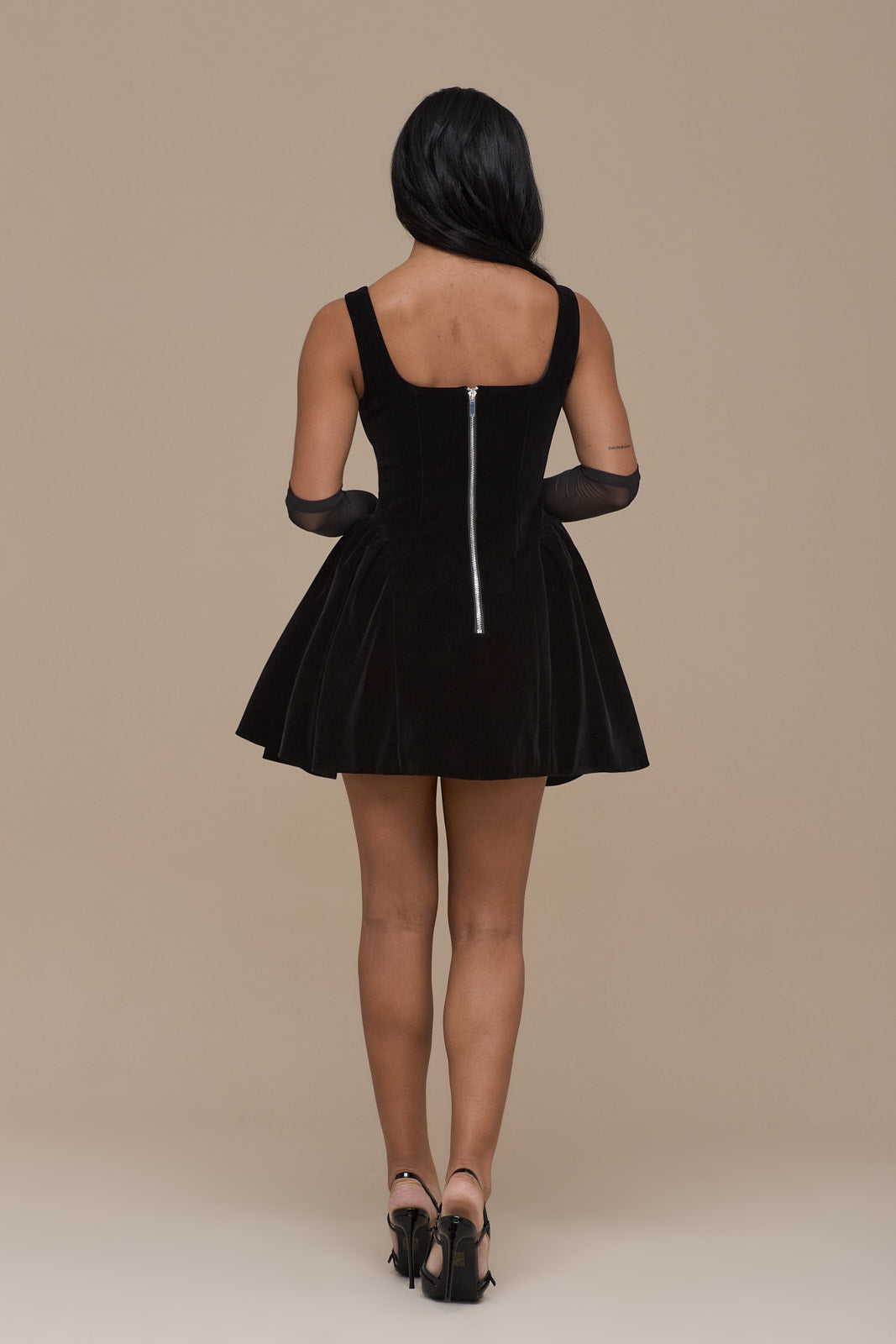 Lucky black velvet mini dress, back view with exposed silver zip