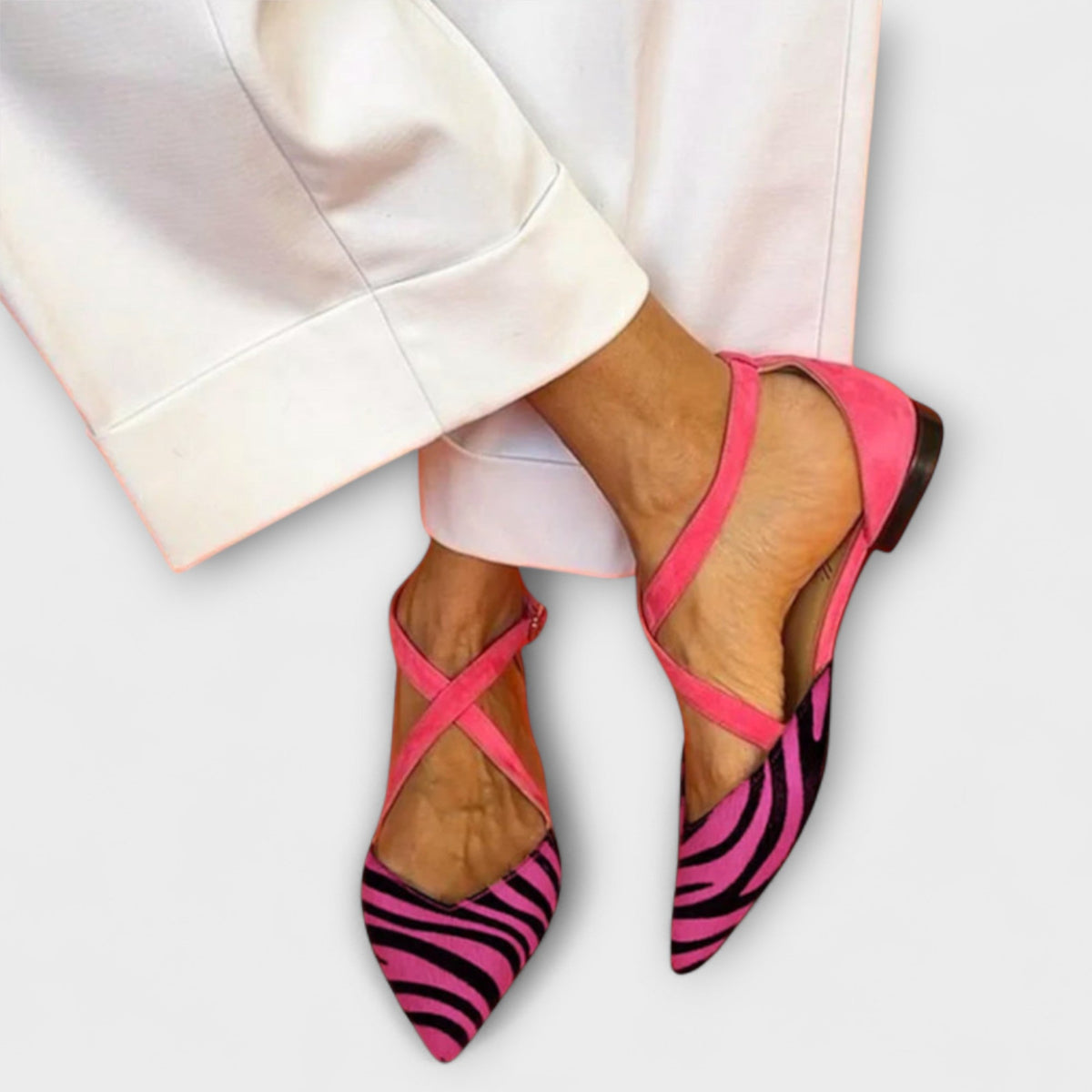 Gabrielle band detail loafers in pink zebra print, worn front view