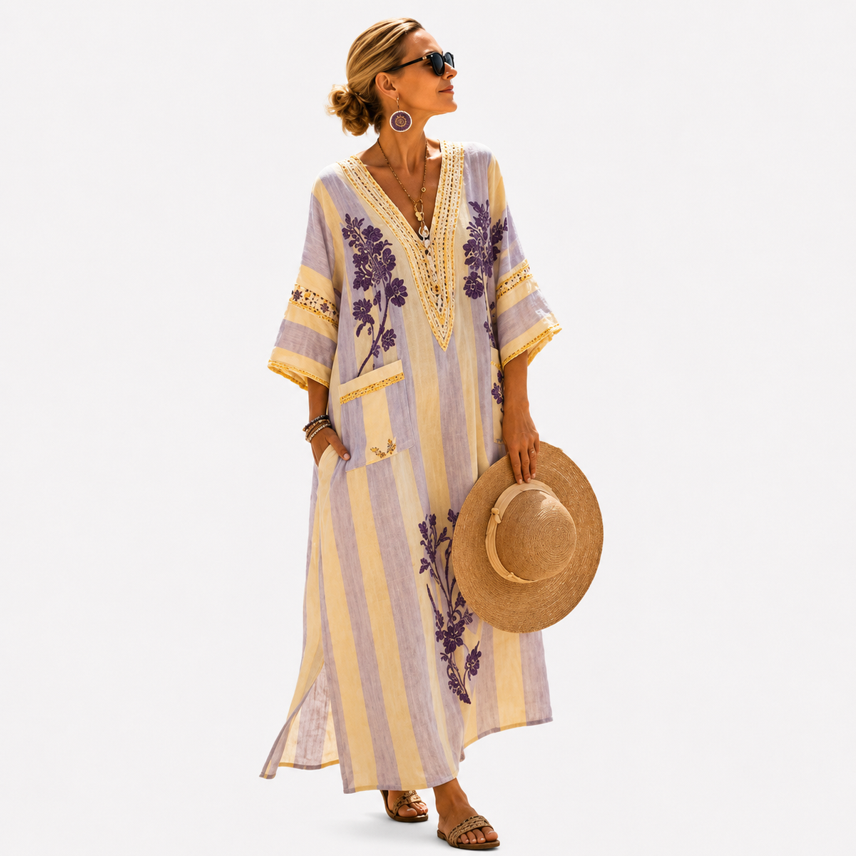 Long kaftan in lavender and yellow stripes with purple floral motifs, full-length front view