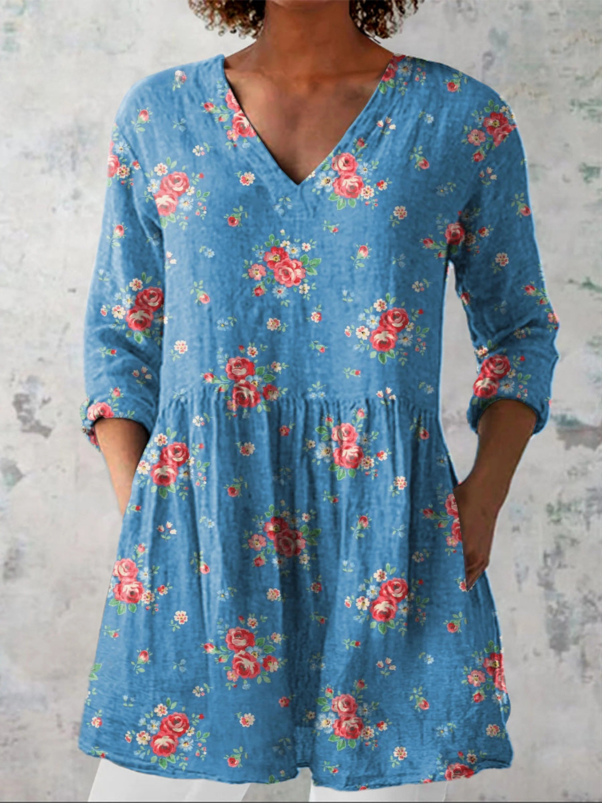 Melanie long V-neck blouse in blue rose print, front view with three-quarter sleeves