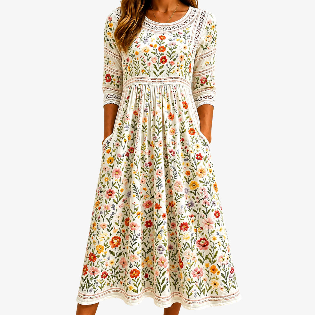 Wildflower meadow midi dress in cream floral print, front view with side pockets