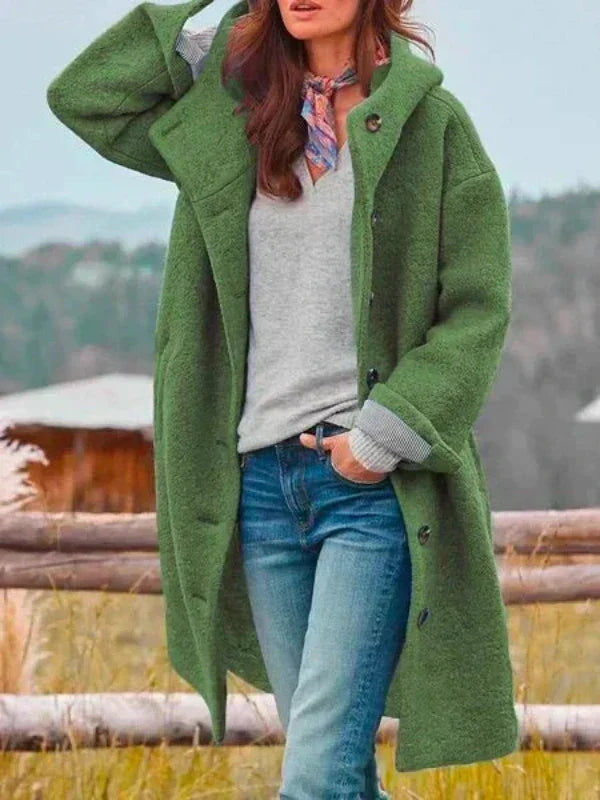 Virginia long hooded coat in green, worn open over jeans