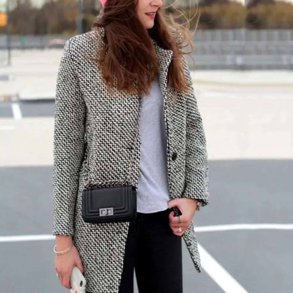 Evadine long check coat worn with jeans and grey tee, front view