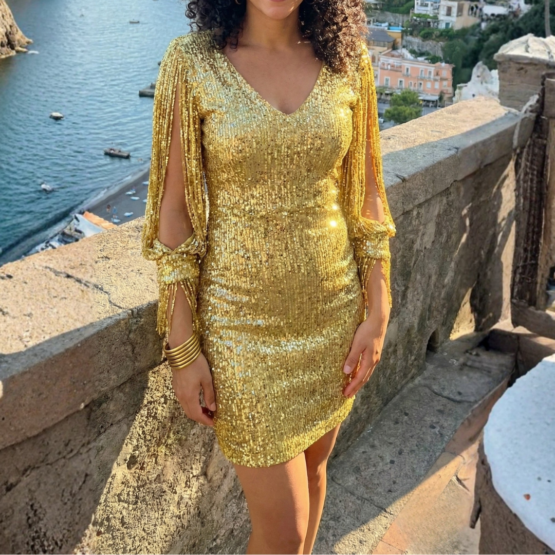 Elowen Stella sequin dress in gold, front view in evening light