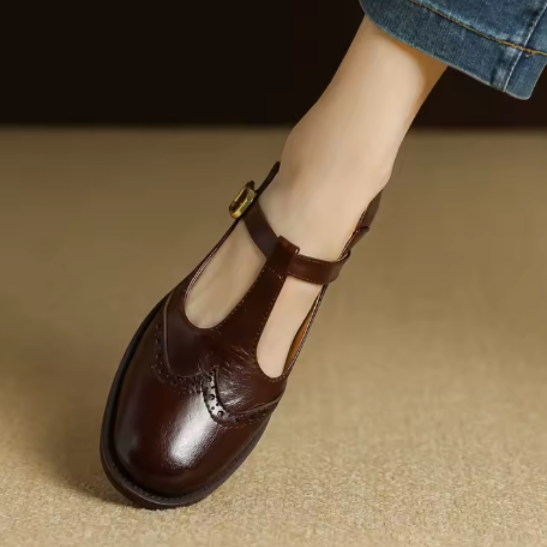 Ysolenne T-bar Mary Jane in brown, close-up of buckle strap