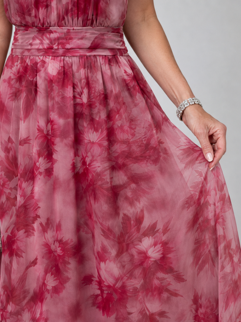 Avien dress close-up of sash waist and blurred floral chiffon skirt