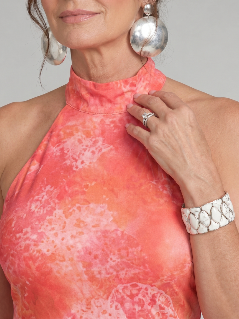 Coraline dress close-up of high halter collar and coral print