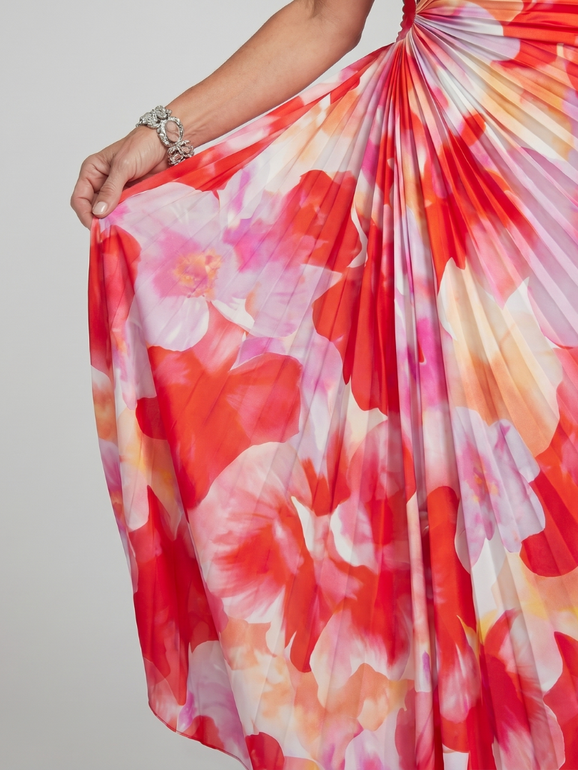 Close-up of Taya dress pleated floral skirt held out to show drape