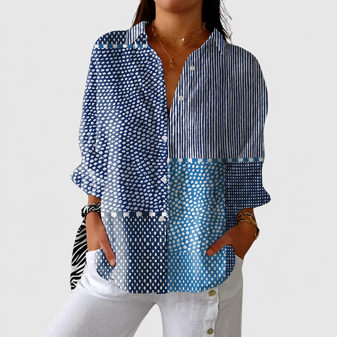 Summer print lightweight weave blouse in blue and white, front view worn with white trousers