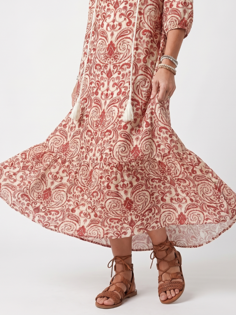 Noelle dress detail of tassel ties and tiered printed hem