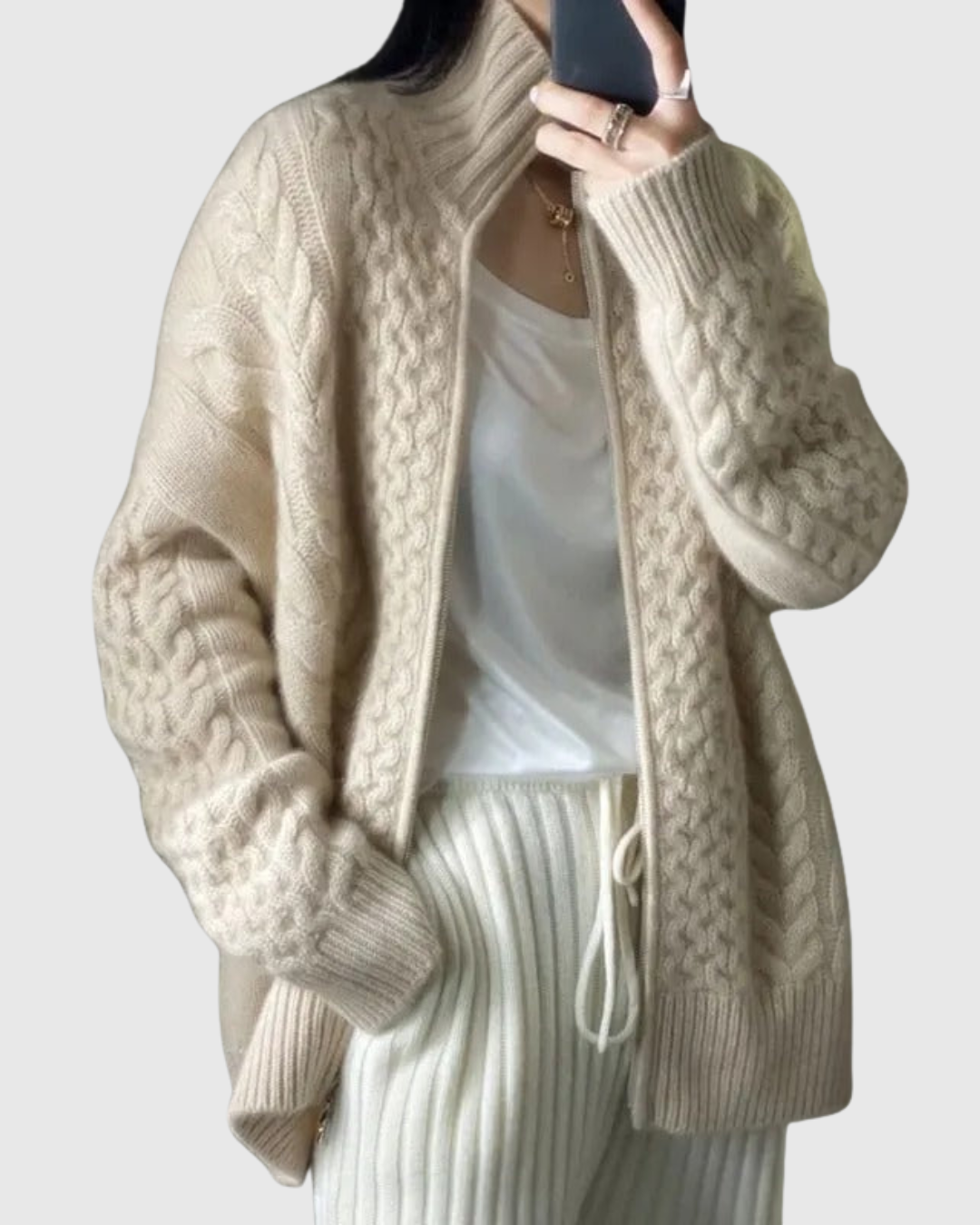 Evarine cable-knit cardigan in cream, relaxed front view with zip open