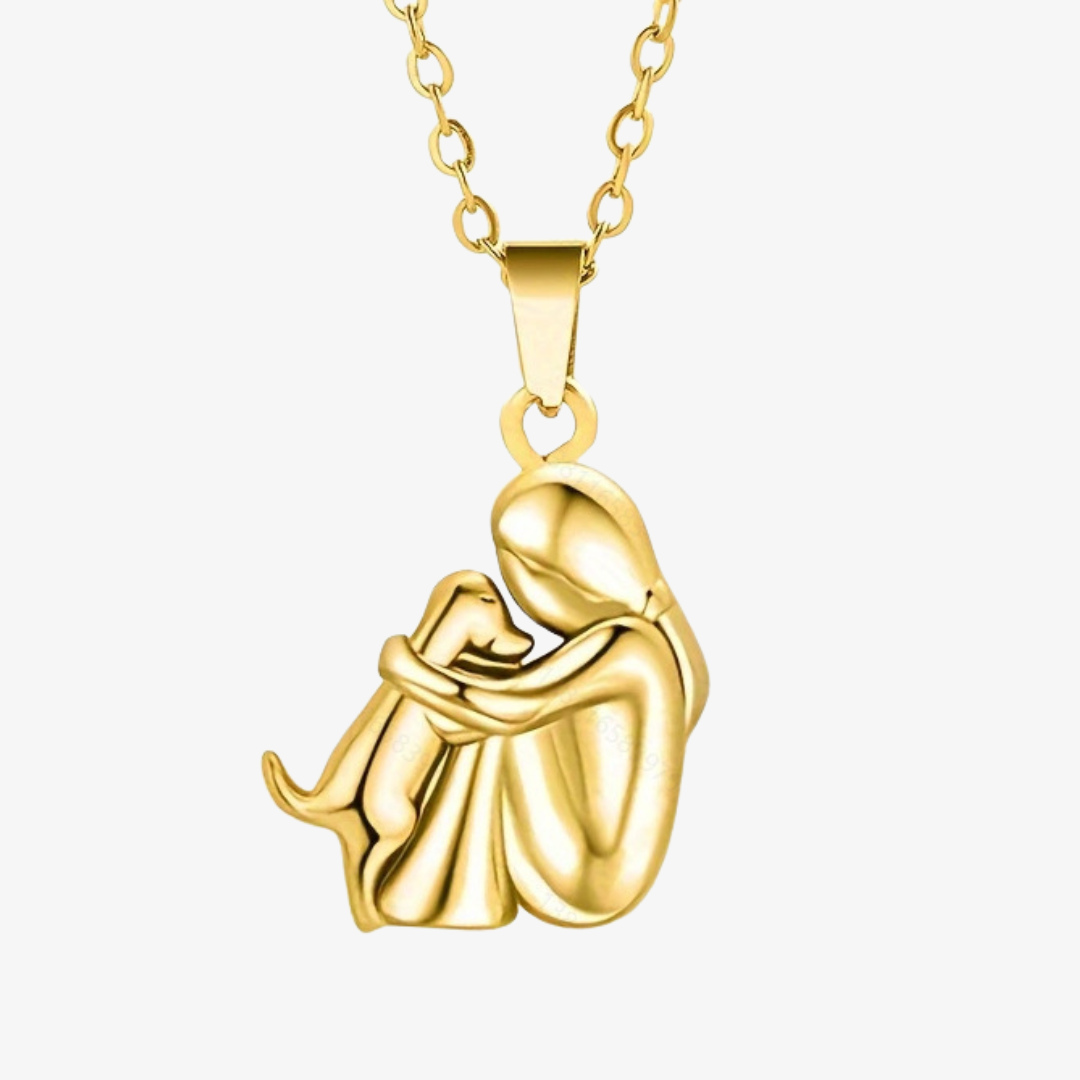 Marinette dog pendant necklace in all gold, front view