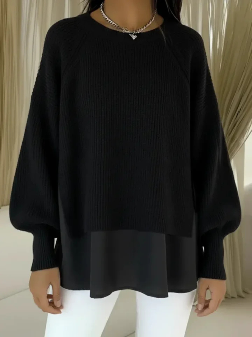 Casilda two-layer effect jumper in black, front view on model