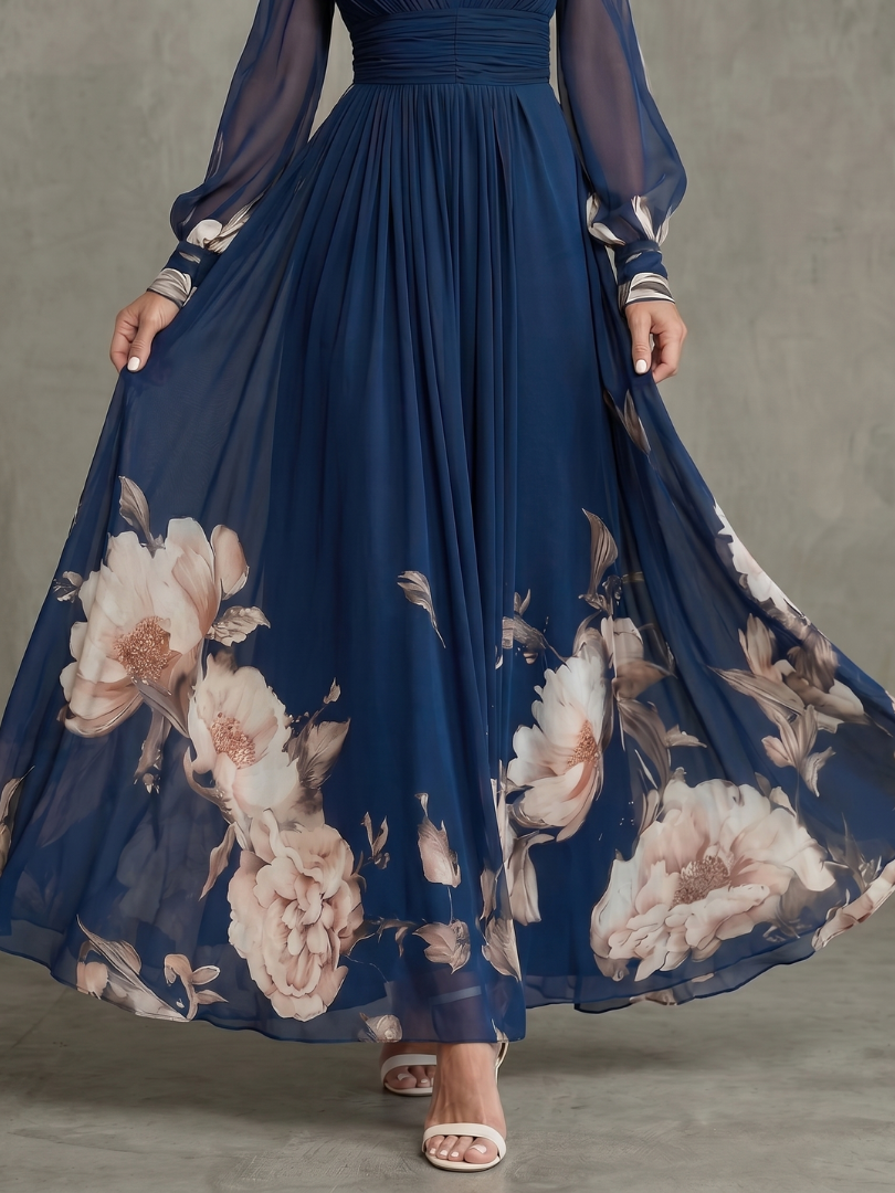 Close-up of the blush floral print on the navy pleated skirt