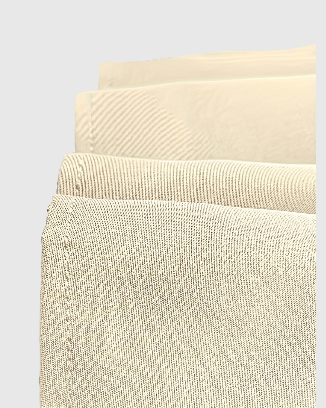 Daphne dress in cream, close-up of fabric and stitched hem