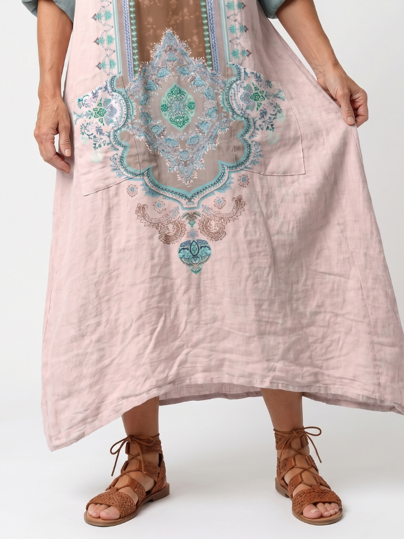Kenza midi dress in pink, close view of embroidered medallion and front pocket