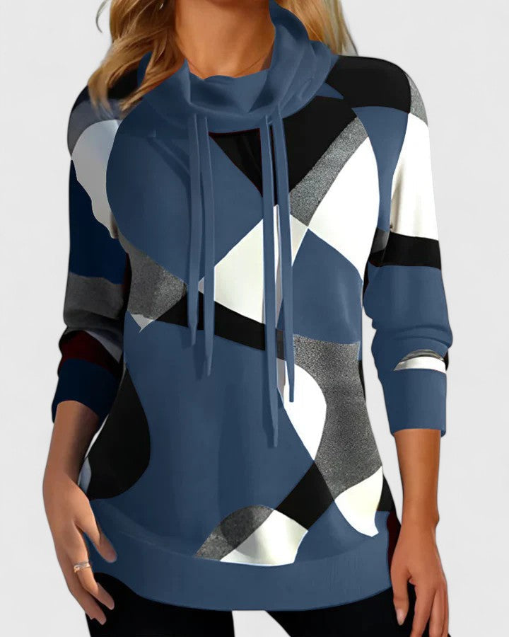 Thalynora colour block sweater in blue, front view worn with dark trousers